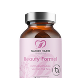 Beauty Formel mit Hyaluronsäure, Vitamin C und Zink, in brauner Glasflasche mit silbernem Deckel, angeschnitten im unteren Bildbereich vor grauem Hintergrund.