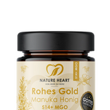 Rohes Gold Manuka Honig 514+ MGO, 50 g im braunen Glasbehälter mit schwarzem Deckel auf grauem Hintergrund.