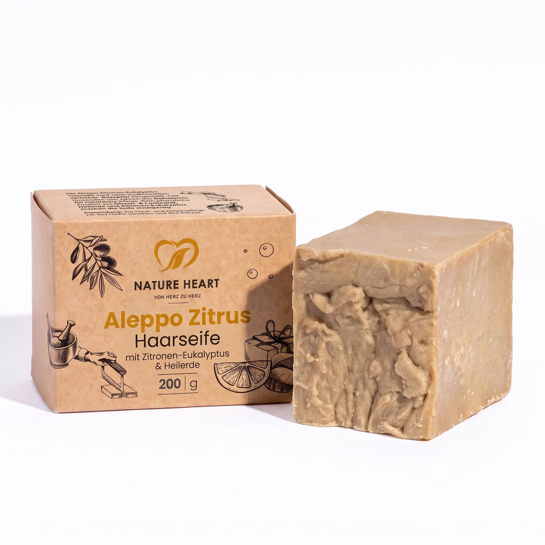Nature Heart Aleppo Zitrus Haarseife 200 g mit Zitronen-Eukalyptus und Heilerde: Seifenstück neben der Kartonverpackung
