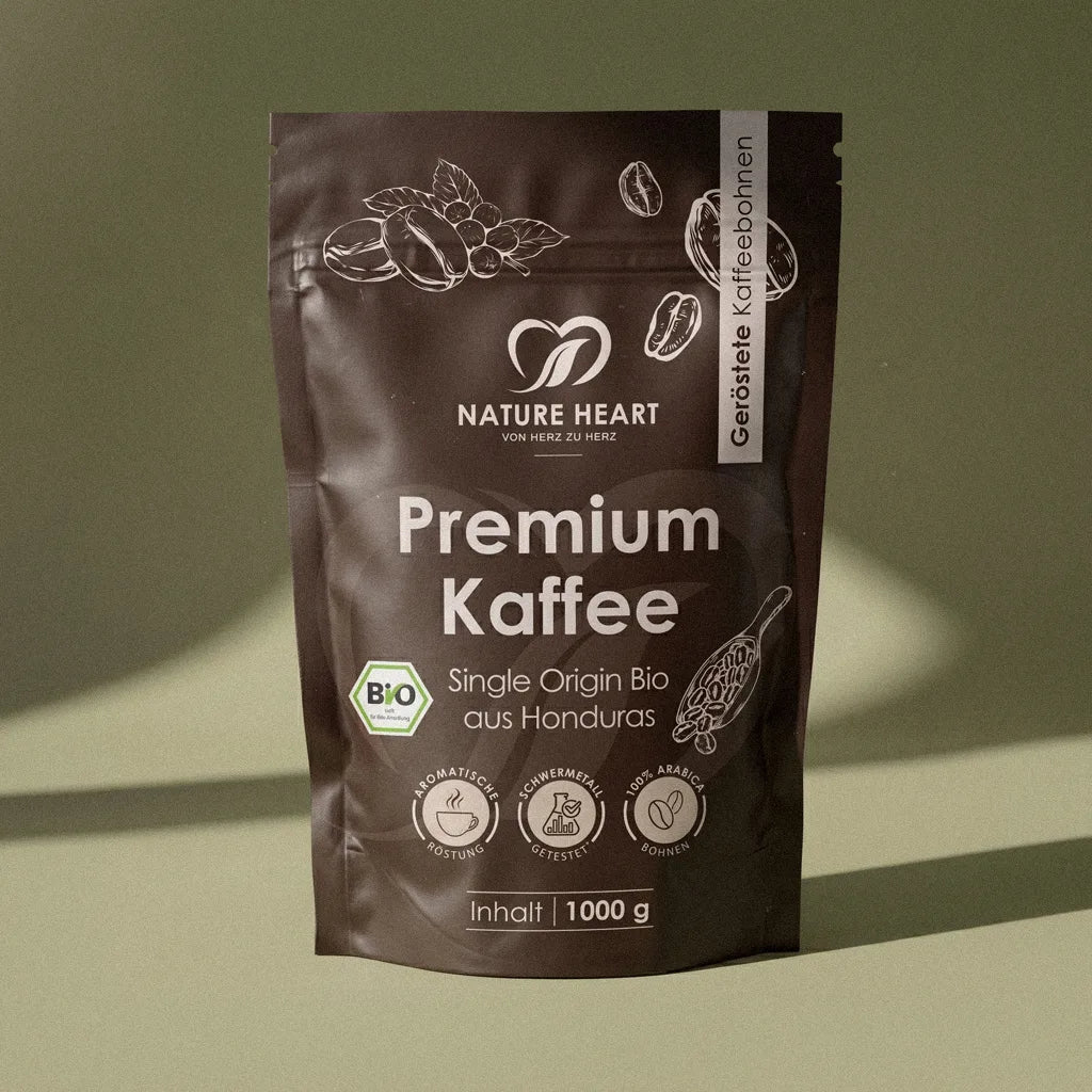Eine braune Stehbeutel-Verpackung von Nature Heart mit 1000 g gerösteten Premium Kaffeebohnen, deklariert als Single Origin Bio aus Honduras und 100% Arabica.